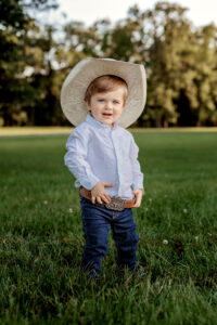 little cowboy standing in field - equestrian photographer Ringgold, Georgia