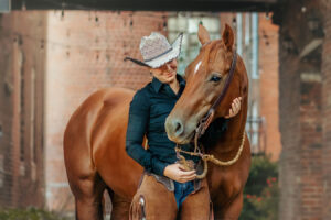 western cowgirl with her red mare at the mill Cleveland, tn