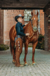 western cowgirl with her red mare at the mill Cleveland, tn