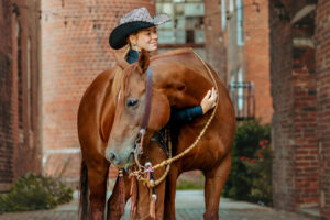 western cowgirl with her red mare at the mill Cleveland, tn