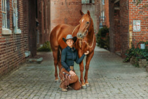 western cowgirl with her red mare at the mill Cleveland, tn