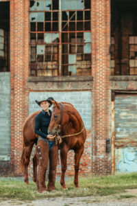 western cowgirl with her red mare at the mill Cleveland, tn