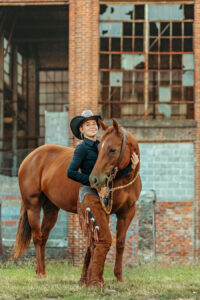 western cowgirl with her red mare at the mill Cleveland, tn