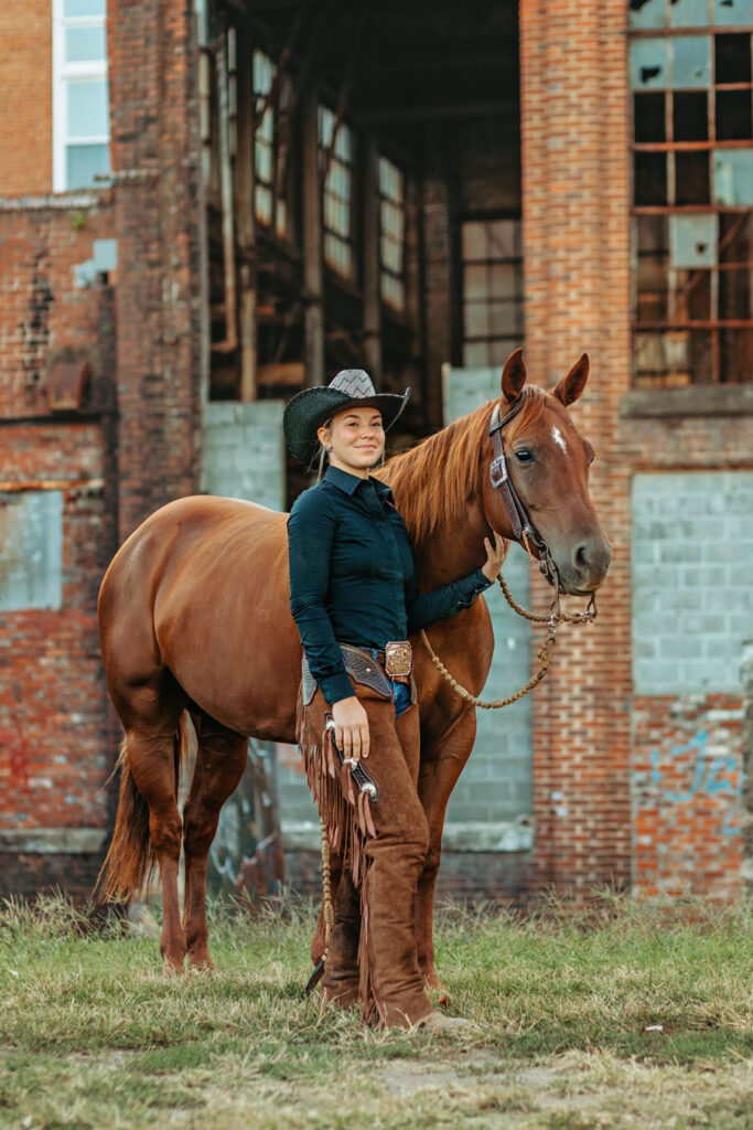 western cowgirl with her red mare at the mill Cleveland, tn