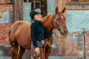 western cowgirl with her red mare at the mill Cleveland, tn