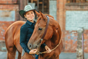 western cowgirl with her red mare at the mill Cleveland, tn