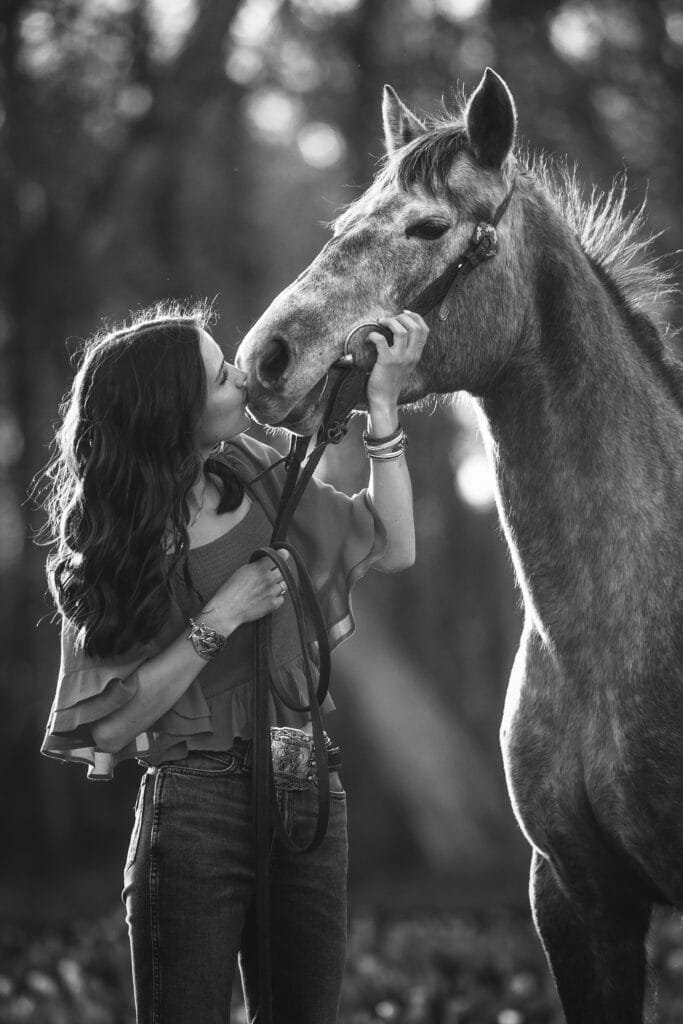 Senior photography with horse in a tulip field